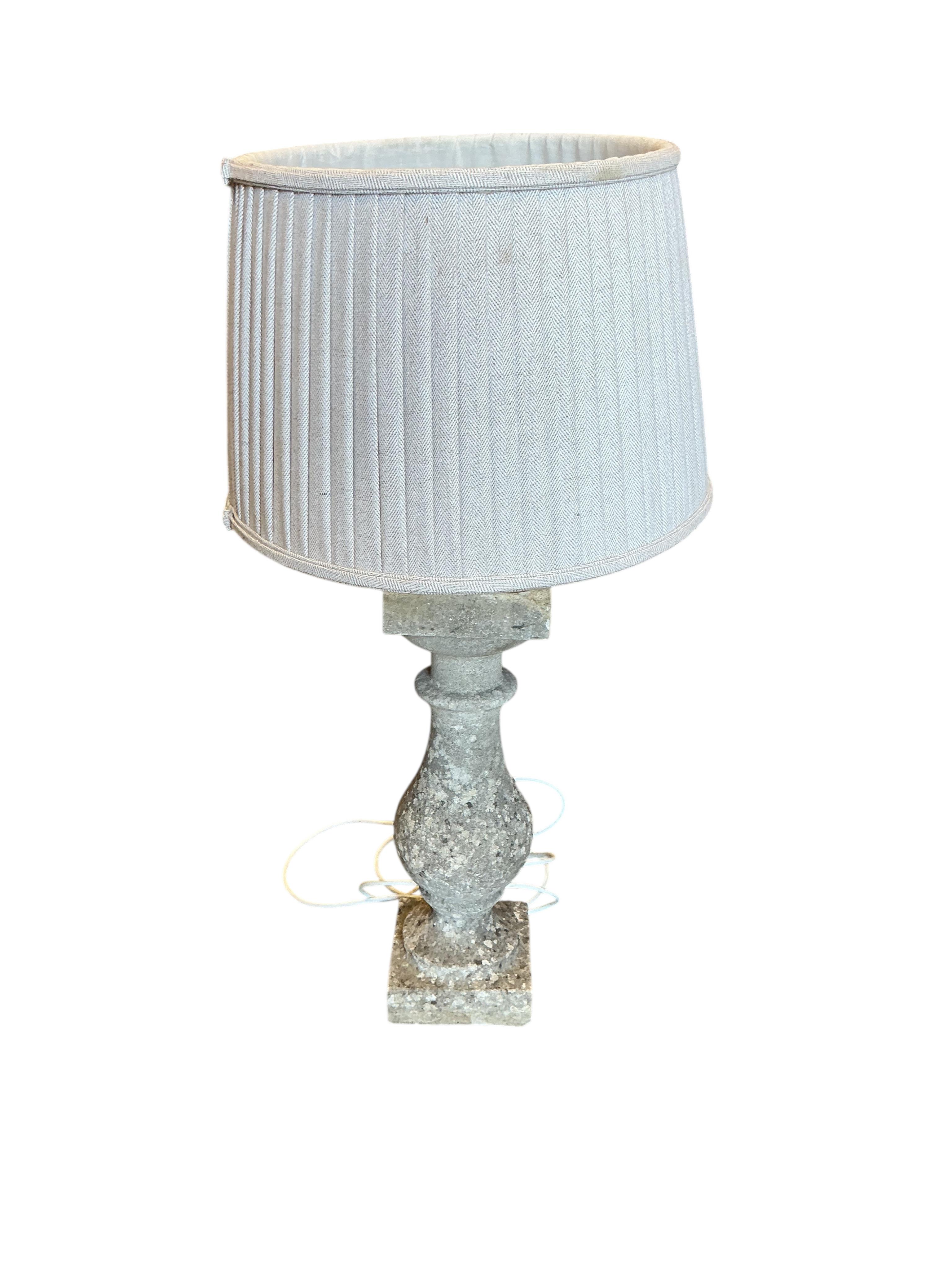 A reconstituted stone baluster table lamp, height including shade 73cm